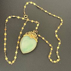 14k Yellow Gold Jade Stone Heart Pendant Necklace 20” Jade Heart in a 14k yellow gold frame Chain: 14k yellow gold Chain Length: 20 inches and 0.14 inches at widest point Total Weight: 19.9 Grams Heart measures 1.05 inches 1.90 inches *Please see images for more details and condition Gold N’ Oldies is a family owned and operated business that has been buying and selling fine jewelry and antiques for over 35 years! Feel free to contact us with any questions and as always... HAPPY BIDDING! Jade Pendant Necklace Gold, Jade Heart Necklace, Yellow Gold Necklace With Heart Charm, Heart Pendant Necklace With Gemstone For Formal Occasions, Luxury Oval Jade Necklaces, Antique Heart Jewelry For Formal Occasions, Antique Heart-shaped Jewelry For Formal Occasions, Antique Heart Shaped Jewelry For Formal Occasions, Vintage Gemstone Heart Pendant Necklace