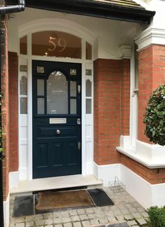 a blue front door on a brick house