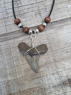 Hand picked Prehistoric Angustidens Shark Tooth made onto a black 18 inch necklace with adjustable links! Tooth size is 1 3/4 inches long! Perfect condition!! Unique Nickel-free Black Necklaces, Unique Nickel Free Black Necklaces, Necklace For Boys, Shark Facts, Bull Shark, Shark Necklace, Shark Tooth Necklace, Tooth Necklace, Shark Tooth