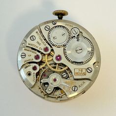 an old pocket watch with gears and dials