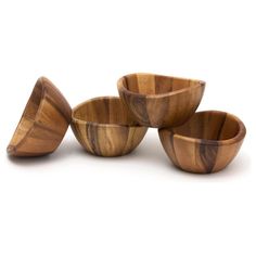 four wooden bowls sitting on top of each other