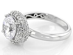 Bella Luce ® white diamond simulant 5.32ctw round, platinum over sterling silver ring. Measures approximately 0.81"L x 0.50"W and is not sizeable. The diamond equivalent weight is 3.47ctw. Silver Halo Ring With Pave Setting And Round Cut, Dazzling Round Halo Ring With Pave Setting, Silver Halo Ring With Pave Setting, Halo Ring With Pave Setting In Cubic Zirconia, Cubic Zirconia Halo Ring With Pave Setting, Fine Jewelry Halo Ring With Pave Setting, White Halo Ring With Vvs Clarity, White Vvs Clarity Halo Ring, Engagement Celebration