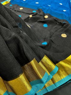 Gorgeous Pure Handloom Saree in Teal and Black Color combination with Gicha Buttas all over the body of the Saree. The borders have Zari Weave. Item : SareeColor : Teal Blue and Black Base Fabric : Pure Handloom Linen Blouse piece : Comes with un-stitched Blouse piece.Blouse material : Pure Handloom Linen Fall & Edging(Yes/No) : Yes Disclaimer -:- Color variation is possible due to various reasons like phone or desktop setting, resolution etc. Please don't hold us responsible. Our aim is to put Festive Black Cotton Silk Saree, Black Cotton Silk Saree With Cutdana, Black Slub Silk Saree, Black Cotton Silk Saree For Diwali, Black Slub Silk Saree With Cutdana, Black Cotton Silk Dupatta With Cutdana, Black Slub Silk Saree Traditional Drape, Black Cotton Silk Saree With Dupatta, Festive Black Slub Silk Saree