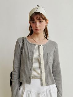 This product is the Morley Cardigan, which exudes a casual yet refined vibe with its textured knit and button-front design. It’s perfect for layering over a tee or a blouse, and features a relaxed fit that ensures comfort without sacrificing style. The cardigan includes a small patch pocket, adding a functional and quaint detail. - The textured knit of the Morley Cardigan adds a cozy and inviting touch to any look.- A button-front design allows for easy styling and versatility in wear.- The relaxed fit provides comfort, making it ideal for day-long wear or layering in cooler temperatures.- A small patch pocket not only adds charm but also a touch of practicality for carrying small essentials. Casual Textured Knit Outerwear For Everyday, Casual Textured Knit Everyday Cardigan, Casual Everyday Textured Knit Cardigan, Casual Gray Textured Knit Cardigan, Casual Gray Cardigan For Everyday, Knitwear Cardigan, Textured Knit, Front Design, Patch Pocket