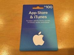 an apple store and itunes gift card sitting on a table