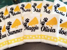 six towels with dog paw prints on them and the names of each towel are shown