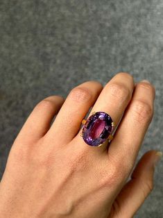 For Sale on 1stDibs - Make a statement with this stunning 17.95 carat purple Amethyst solitaire cocktail ring. The center stone is completely clean, with no inclusions at all, Yellow Gold Cocktail Ring, Gold Cocktail Ring, Gold Cocktail, Cocktail Ring, Purple Amethyst, Cocktail Rings, Amethyst, Yellow Gold, Stone