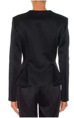 This black Christopher Kane jacket features a high rounded neck and a tailored construction with godet at the front accented with tulle. Hidden front hook and eye closures. 70% polyamide, 17% viscose, 13% acetate. Fully lined. This style runs true to size.Made in Italy Size UK8 Bust 33" Waist 28" Length shoulder to hem:23" Black Fitted Outerwear With Structured Boning, Structured Blazer For Evening And Fall, Black Structured Boning Outerwear For Evening, Fitted Black Outerwear With Structured Boning, Structured Blazer For Evening In Fall, Structured Black Evening Outerwear, Fitted Black Outerwear With Concealed Front Fastening, Black Structured Evening Outerwear, Black Long Sleeve Blazer With Structured Boning