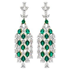 A delicate and exquisite pair of chandelier earrings showcasing 5.92 carats total of 18 oval cut and 1 pear shape color-rich green emerald, set in an elegant dangling waterfall design with 8.92 carats total of brilliant oval, pear and marquise cut diamonds. Perfectly made in 18k white gold. 6.13 mm in width and 19.24 mm in length. Roman Malakov is a custom house, specializing in creating anything you can imagine. If you would like to receive a special quote on a custom piece please message or ca Luxury Green Gemstone Chandelier Earrings, Luxury Green Chandelier Earrings For Celebration, Emerald Set, Diamond Chandelier Earrings, Diamond Chandelier, Platinum Bracelet, Gold Chandelier Earrings, Waterfall Design, Platinum Earrings