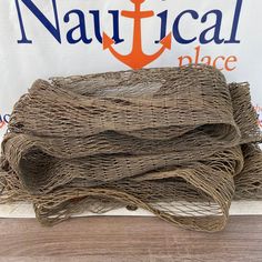 there are three pieces of burlap on top of each other in front of a nautical place sign