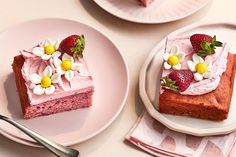 two plates with slices of strawberry cake on them