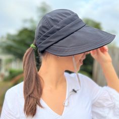 FREE Standard U.S Shipping on all orders over $35 💕 This Wide brim ponytail sun hat for women is made of breathable polycotton fabric, lightweight and comfortable to wear. Foldable beach summer hat: packable will fit your handbag or backpack when not in use, so you can bring this cap everywhere with you. Comes with removable chin strap for windy days. Can be used at a variety of outdoor activities: hiking, tennis, running, golf, travel, kayaking hat. This large brim hat will make nice shade for Lightweight Solid Sun Hat, One Size Fits Most, Solid Color Visor Hat For Outdoor Activities, Lightweight Black Casual Sun Hat, Wide Brim Upf 50+ Visor For Travel, Black Lightweight Casual Sun Hat, Breathable Adjustable Solid Sun Hat, Breathable Adjustable Sun Hat, Solid Breathable Sun Hat With Adjustable Fit, Travel Sun Hat With Adjustable Fit