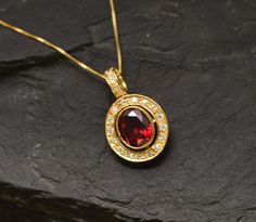 Antique Ruby Pendant set with a Created Ruby in perfect diamond cut, flawless clarity & deep red color, at 10x8mm, 3 Carats, surrounded by CZ Diamonds. Red Vintage Pendant design made of Gold Vermeil ☞ thickest 18k Gold Plating on top of Solid 925 Sterling Silver ☞ made to last. Matching Ring: www.etsy.com/listing/761089210 Matching Earrings: www.etsy.com/listing/963504392 Free Vermeil Chain with every Pendant order, 18 inch Silver chain (46 cm) ✓ Details : ♥ Each item comes in a cute GIFT BOX ✓ Ruby Necklace Gold, Ruby Pendant Set, Real Ruby Necklace, Ruby Necklace Designs, Blue Topaz Pendant, Ruby Pendant, Deep Red Color, Ruby Necklace, Vintage Pendant