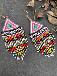 Colorful Tiny Beads Dangle Earrings, Colorful Dangle Earrings With Tiny Beads, Traditional Multicolor Beaded Chain Earrings, Handmade Colorful Beaded Drop Earrings, Traditional Multicolor Beaded Earrings With Beaded Chain, Colorful Beaded Drop Earrings, Colorful Bohemian Earrings With Tiny Beads, Multicolor Beaded Chain Dangle Beads, Multicolor Dangling Beads Drop Earrings