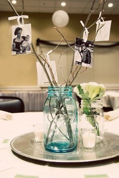 a glass vase filled with flowers on top of a table