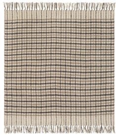 a beige and black checkered rug with fringes