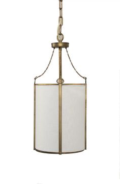 a light fixture with a white shade hanging from it's side and the bottom