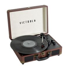 a suitcase with a record player in it and the word victrolo on top