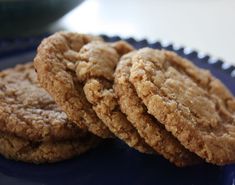 three cookies sitting on top of a blue plate