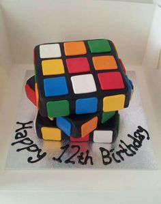 a birthday cake made to look like a rubik cube