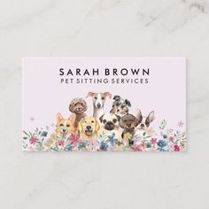 business card with four dogs and flowers on the front, featuring an image of three puppies