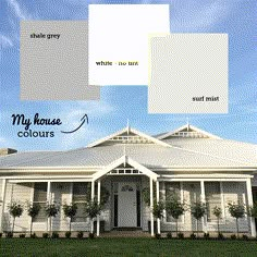 the exterior of a house with white and gray paint colors on it's walls