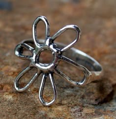 Super Springy! Sterling silver flower ring. Flower is approx 3/4 inch wide. Artisan made and cast in the USA Silver Flower Ring, Metalsmithing Jewelry, Indie Jewelry, Ring Flower, Jewelry Tattoo, Dope Jewelry, Wide Rings, Homemade Jewelry, Funky Jewelry