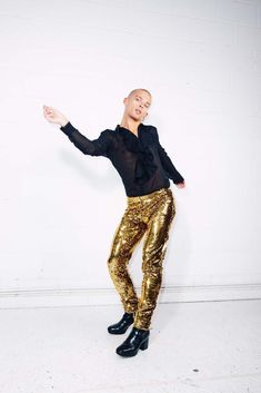 "Disco inspired gold party pants for those who want to make an entrance! Made of a stretch sequin fabric and fully lined with soft jersey, so you can comfortably bust the moves on the dance floor - without busting a seam. Classic, gender neutral design, for a dazzling party outfit that will last a lifetime. Elasticated waistband Pockets in lining Fully Line Mid rise True to size, order a size up for a looser leg fit 83cm inseam on all sizes   Models Wear: Riley is 5'11 and wears a size 31-32\" ( Gold Stretch Bottoms For Party, Gold Stretch Bottoms For Night Out, Glamorous Stretch Gold Bottoms, Glamorous Gold Stretch Bottoms, Metallic Stretch Bottoms For Party, Stretch Metallic Bottoms For Party, Disco Style Holiday Party Pants, Fitted Gold Bottoms For Party Season, Glamorous Fitted Gold Bottoms