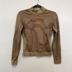 Kappa Authentic Jaworzno Logo Print Long Sleeve Tight Shirt Beige Brown Size M/L | eBay Sporty Brown Long Sleeve Tops, Brown Long Sleeve Sporty Tops, Khaki Crew Neck Top For Winter, Winter Crew Neck Khaki Top, Stretch Brown Long Sleeve Tops, Brown Stretch Long Sleeve Top, Winter Khaki Crew Neck Top, Fitted Crew Neck T-shirt In Khaki, Fitted Sporty Beige Top