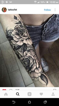 a woman's arm with black and white flowers on the left side of her body