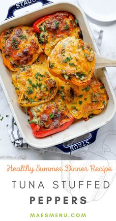 a casserole dish filled with stuffed peppers and topped with parmesan cheese