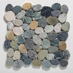 several different colored rocks are arranged in the shape of a square