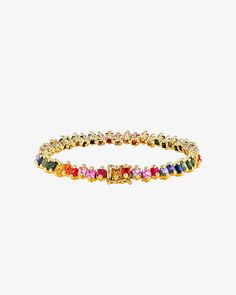 Discover the elegance of our Princess Milli Tennis Bracelet, featuring 10.50 carats of princess-cut rainbow sapphires in a unique staggered setting. Perfect for layering or making a sophisticated statement on its own, this bracelet offers versatile styling options to enhance any ensemble. Details 18k yellow gold 10.50 carats of 3x3mm princess-cut rainbow sapphires Bracelet measures 7" inches in length Box clasp with safety lock fastening 5.75mm width Ref: AKB540 Elegant Rainbow Diamond Jewelry, Elegant Multicolor Cubic Zirconia Bracelets, Luxury Rainbow Cubic Zirconia Jewelry, Elegant Multicolor Bangle Tennis Bracelet, Elegant Rainbow Colored Bangle Jewelry, Elegant Rainbow Round Bracelets, Elegant Multicolor Tennis Jubilee Bracelet, Elegant Multicolor Jubilee Tennis Bracelet, Luxury Multicolor Cubic Zirconia Tennis Bracelet