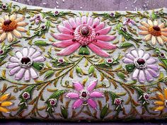 "Sweet and feminine soft gray silk clutch, perfect for a wedding, embroidered with glowing pastel colored silk flowers and embellished with metallic threads and genuine star rubies to create an opulent, glittery, dazzling 3D effect. The embroidery is both sides, front and back. This is a work of art, a beautiful wardrobe investment piece, a modern heirloom to be cherished and passed down to the next generation. Expertly hand embroidered by the most skilled zardozi artisans. The word Zardozi mean Elegant Multicolor Embroidery Bag For Gift, Pink Bags For Evening And Festivals, Elegant Multicolor Evening Bag, Elegant Evening Bag For Wedding And Festivals, Elegant Evening Bag For Wedding, Multicolor Clutch Evening Bag For Wedding, Hand Embellished Evening Bag For Wedding Festivals, Hand Embellished Evening Bag For Wedding And Festivals, Luxury Multicolor Evening Bag For Wedding