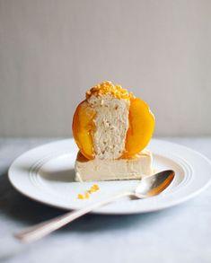 a piece of cake on a plate with a spoon