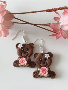 Cute brown bear earrings holding a pink rose with silver micro beads, and they are adorned with a white daisy on the head. They are very cute in real, and so lightweight that it is so easy to use everyday. Perfect for any occasion, style or outfit.  The earrings are made of polymer clay. Though polymer clay is a sturdy material, I still suggest to handle your earrings with care. The earrings are similar but not the same as it is handmade. There will be flaws in the clay, dainty imperfections, du Cute Clay Drop Earrings, Cute Pink Polymer Clay Earrings, Cute Brown Dangle Earrings, Cute Polymer Clay Flower Earrings For Gifts, Cute Polymer Clay Earrings For Valentine's Day, Cute Brown Earrings Gift, Cute Brown Earrings As Gift, Cute Brown Earrings For Gift, Cute Polymer Clay Flower Earrings