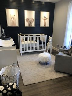 a baby's room is decorated in gray and white