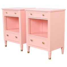 two pink nightstands side by side with gold handles