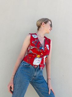 Awesome red nautical vest by Liz Claiborne. The vest is made of rayon and featured with 5 gold tone buttons in XS size . It can be a good mix style with basic tees, statement collar blouses and even just as vest top . In the last photo you can see a few red spots, but they are not noticeable as they look like part of the print.  Condition: In good condition. Some spots on the last picture.  Label: Liz Claiborne petit collection. Material: 100% rayon , lining 100% acetate.  Size: P ( XS) but can Vintage Red Sleeveless Top, Retro Red Sleeveless Vest, Red Sleeveless Retro Vest, Vintage Red Vest Top, Red Sleeveless Vest With Buttons, Fitted Red Vest With Buttons, Fitted Red Tops With Snap Buttons, Vintage Red Vest For Summer, Red Vintage Vest For Summer