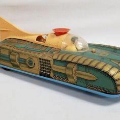 a toy model of a yellow and blue speed boat