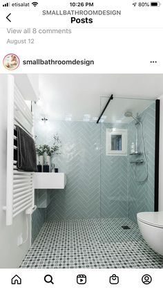 a bathroom with green and white tiles on the floor