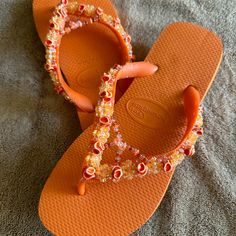 Havaianas Hand Beaded One-Of-Kind Flip Flops That Sparkle In The Sun. Size 7/8 These Lovely Orange Sandals Feature Beads Of Lighter Orange And Coral. These Are New (Never Worn). Beaded Flip Flops For Spring Beach, Casual Beaded Flip Flops For Summer, Spring Beach Flip Flops With Beads, Spring Beach Beaded Flip Flops, Embellished Flip Flops With Round Toe For Beach, Embellished Flip Flops For Beach, Beach Embellished Flip Flops, Casual Adjustable Embellished Sandals, Casual Embellished Adjustable Sandals