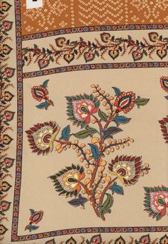 an intricately designed rug with flowers and leaves