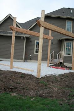 a wooden frame in front of a house