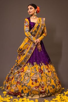 Purple base attached cancan lehenga with women kalamkari hand painted patterns and embroidery. Paired with padded purple blouse embroidered with glass beads and yellow printed dupatta. - Aza Fashions Kalmkari Pattern Lehenga, Kalamkari Painting Saree, Traditional Silk Lehenga Designs, Kalamkari Lehangas Designs, Penkalamkari Lehanga, Kalamkari Half Saree Lehenga, Kalamkari Dupatta With Dress, Pen Kalamkari Lehangas, Half Saree Blouse Designs Pattern