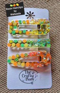 the crafty mom clips are made out of plastic and have colorful beads on them