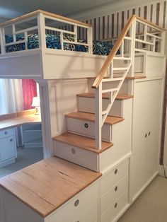 there is a loft bed with stairs in the room