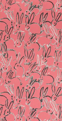 a pink background with black and white rabbit heads on the front, and grey lines in the back