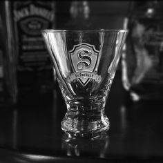 an empty glass sitting on top of a table