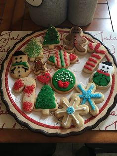 a plate full of decorated cookies on a table